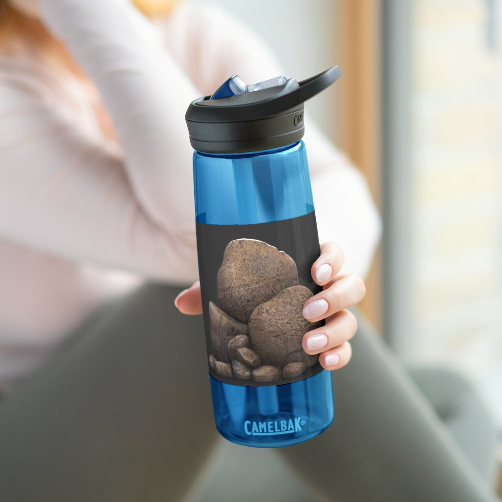 Rocks CamelBak Eddy® Water Bottle in 20oz and 25oz sizes, showcasing its durable Tritan™ material and spill-proof design.